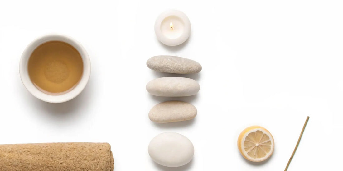 Using natural, calming items like tea and a candle to find mood balance for anxiety.