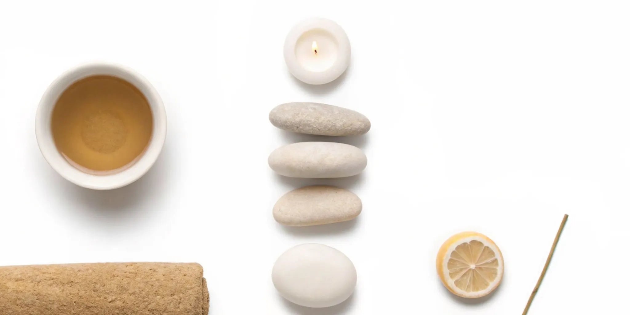 Using natural, calming items like tea and a candle to find mood balance for anxiety.