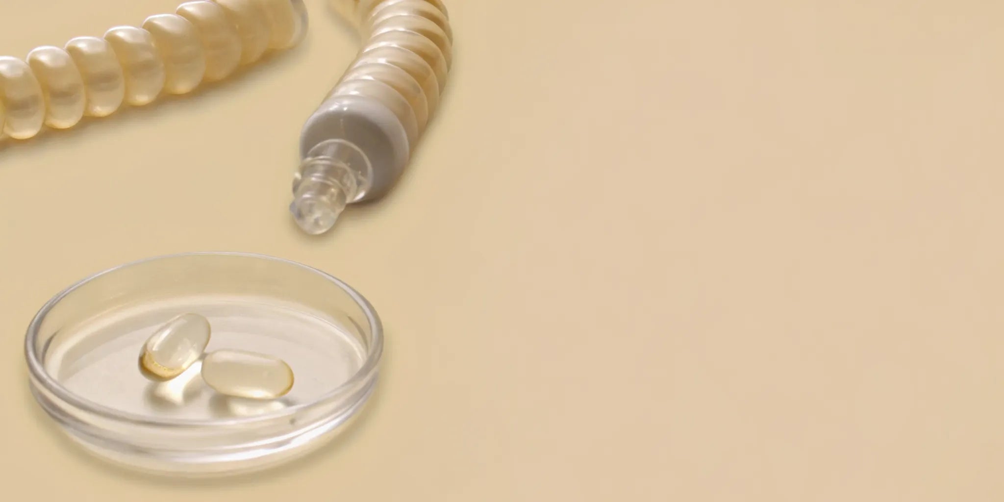 A petri dish of clear capsules, the best postbiotics for irritability.