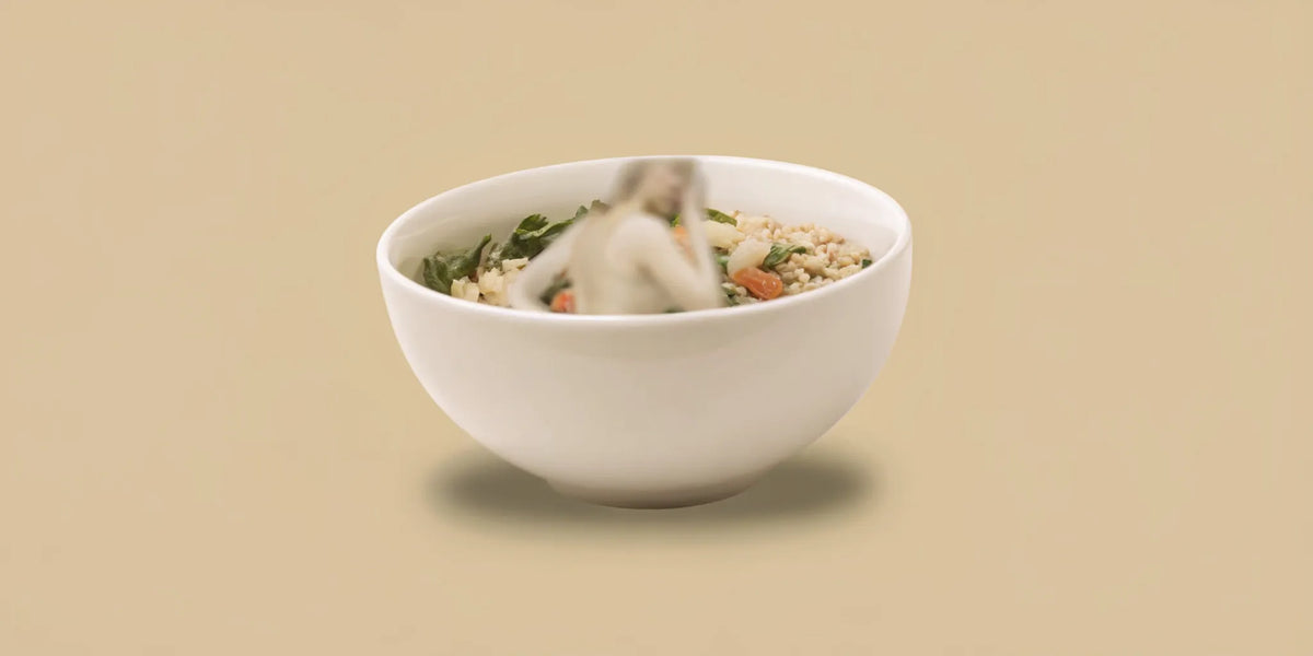 Healthy vegetable bowl and woman experiencing bloating