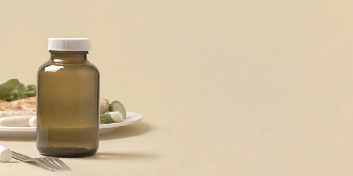 A gut health supplement for bloating next to a plate of food.