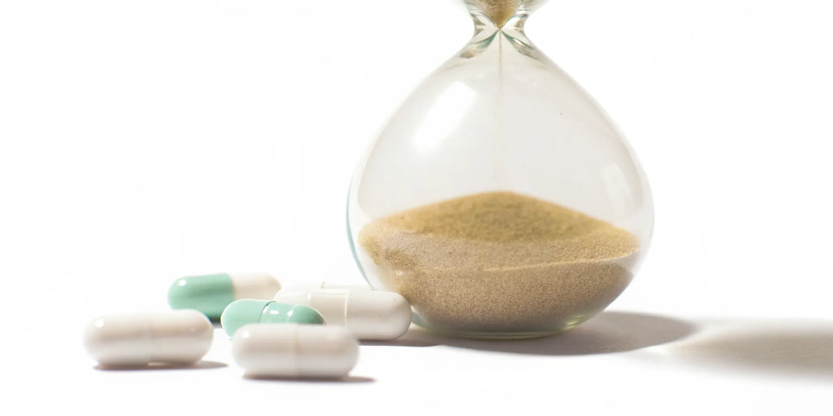Hourglass measuring how long it takes for probiotics to work for bloating and improve digestive health.
