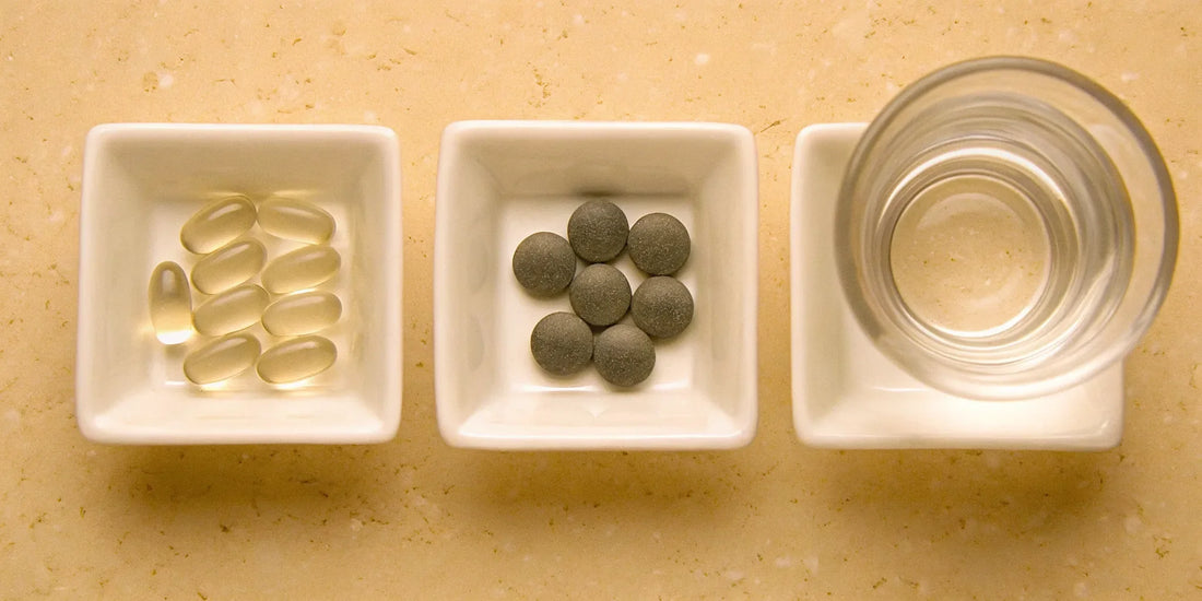 A daily routine of mood balance supplements with a glass of water.