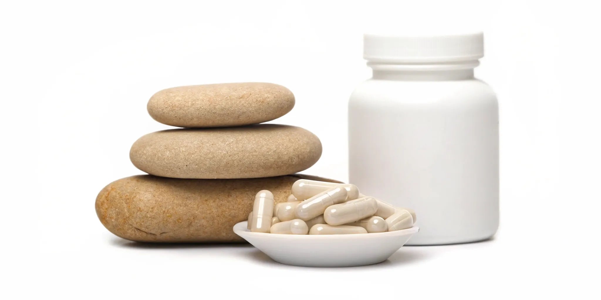 A mood balance product with capsules and stacked stones, symbolizing finding emotional balance.