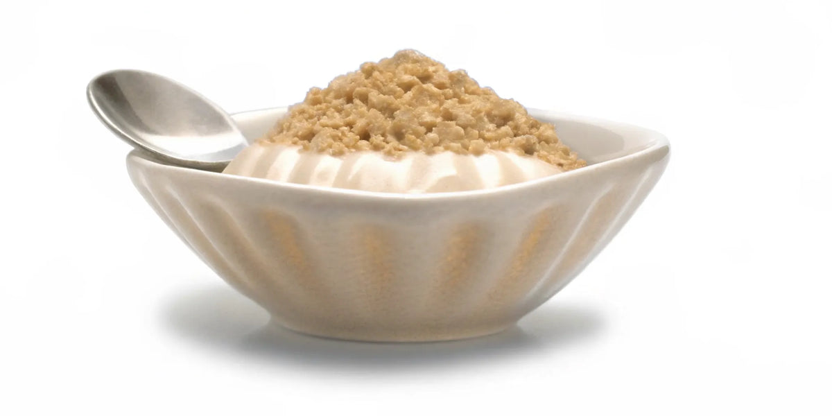 Oatmeal in a bowl, a sign your gut supplement is working to improve digestive health.