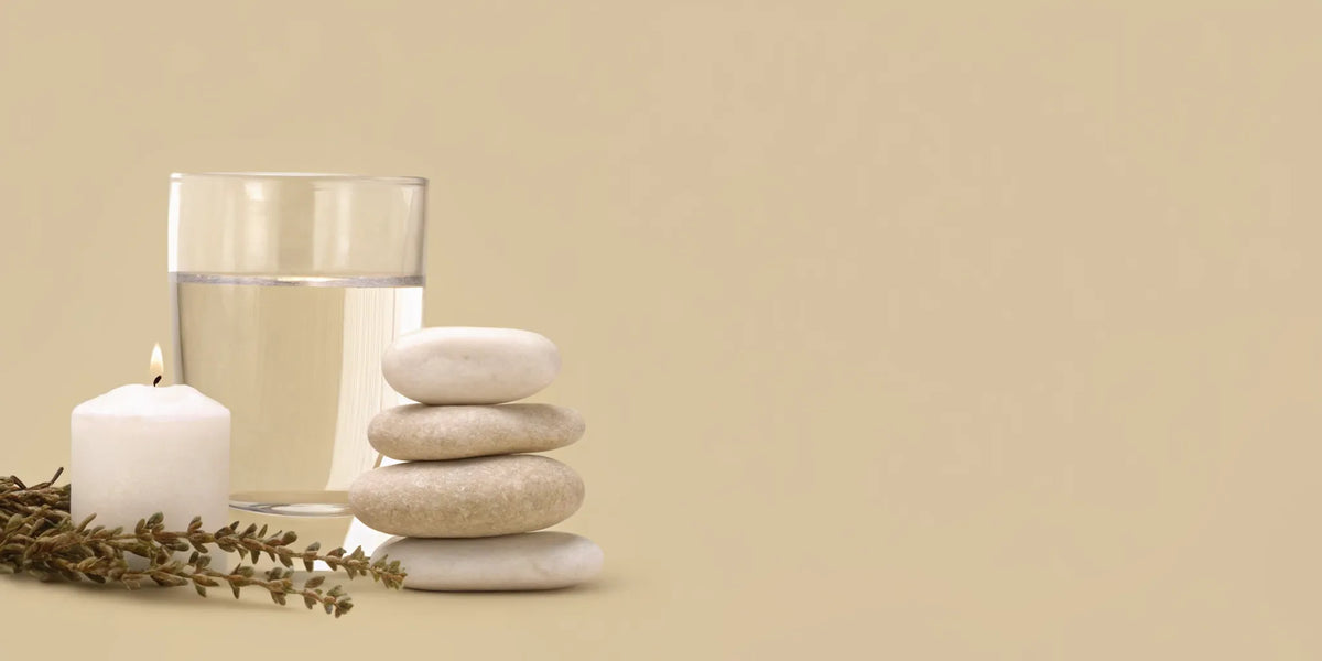 Calming herbs and water representing natural supplements for anxiety and gut-brain support