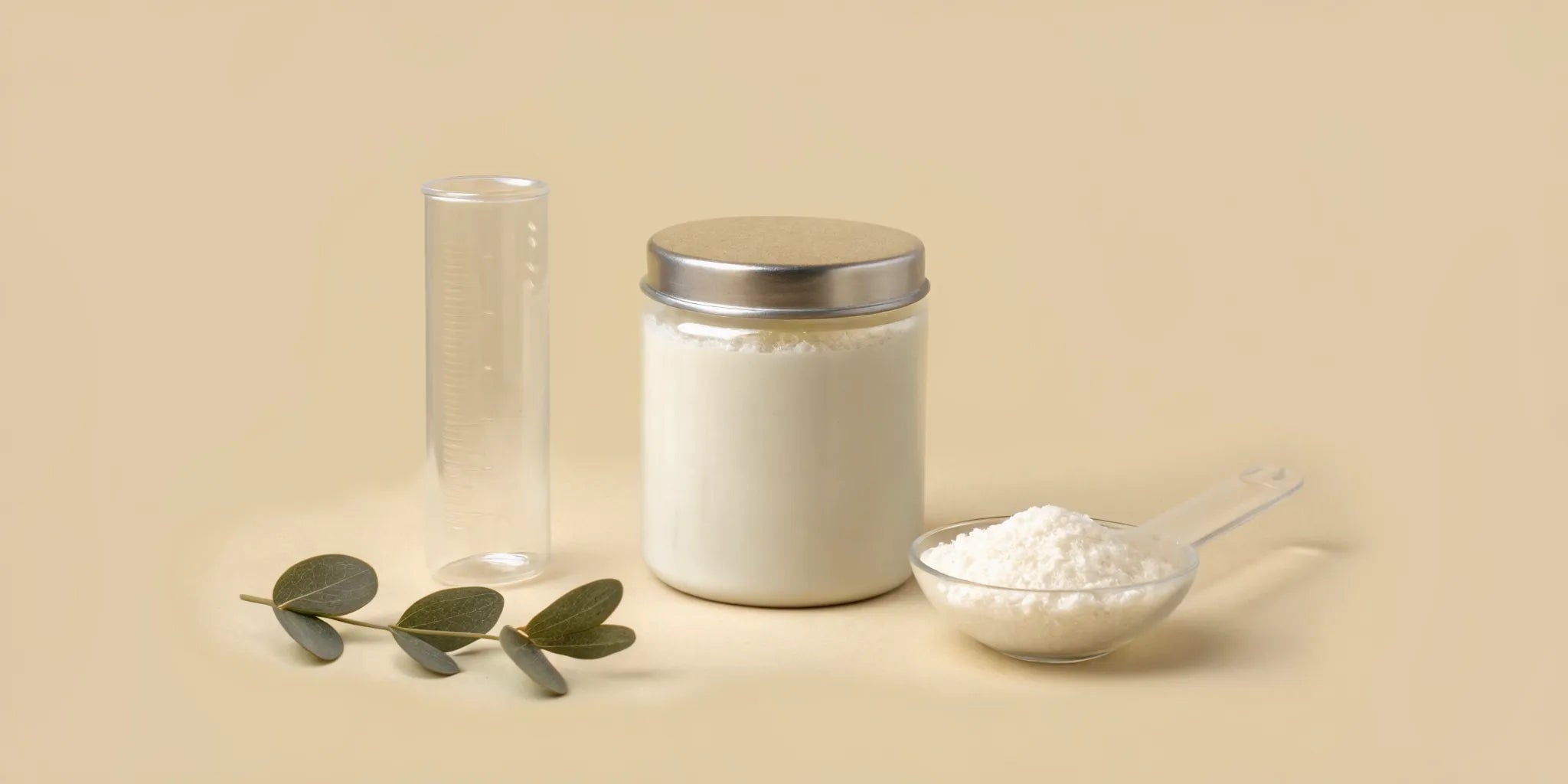 Postbiotic powder supplement in a jar with a measuring scoop.