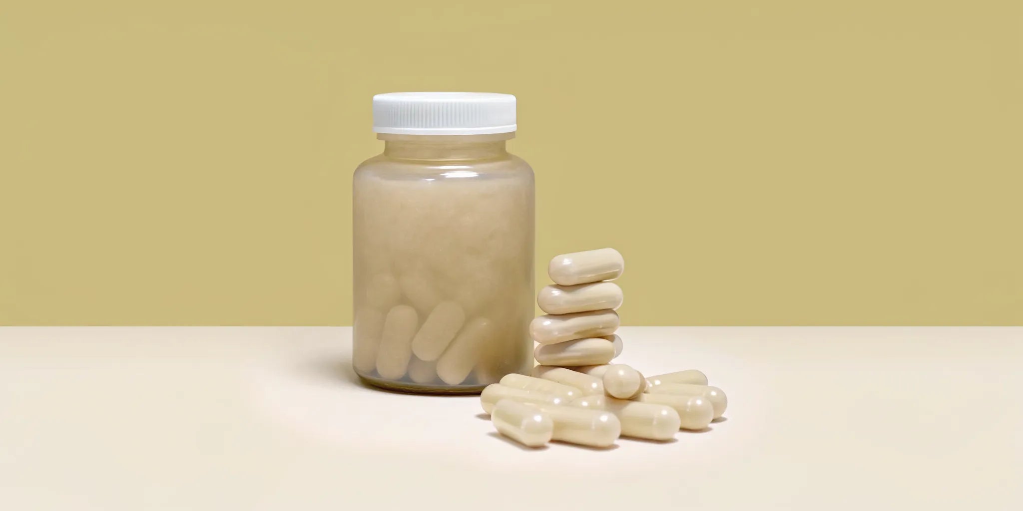 Postbiotic supplement bottle and capsules for gut health and digestion.