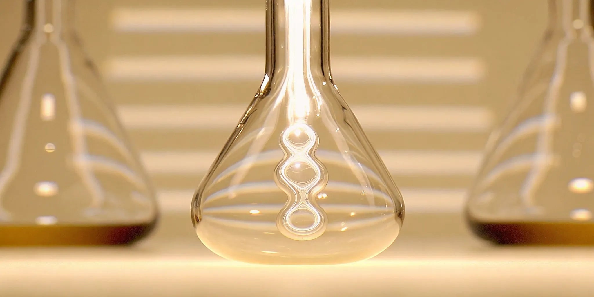 A laboratory flask showing the science of postbiotics explained for better gut health.