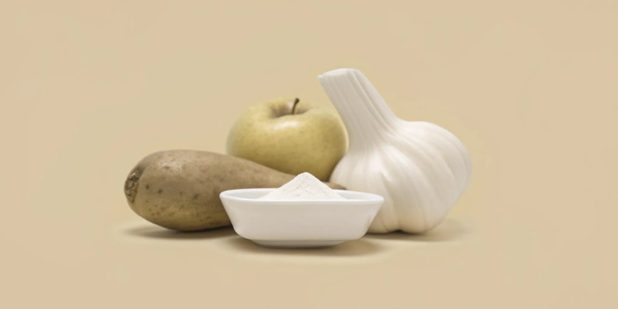 Prebiotics for bloating: potato, apple, garlic, and prebiotic powder.