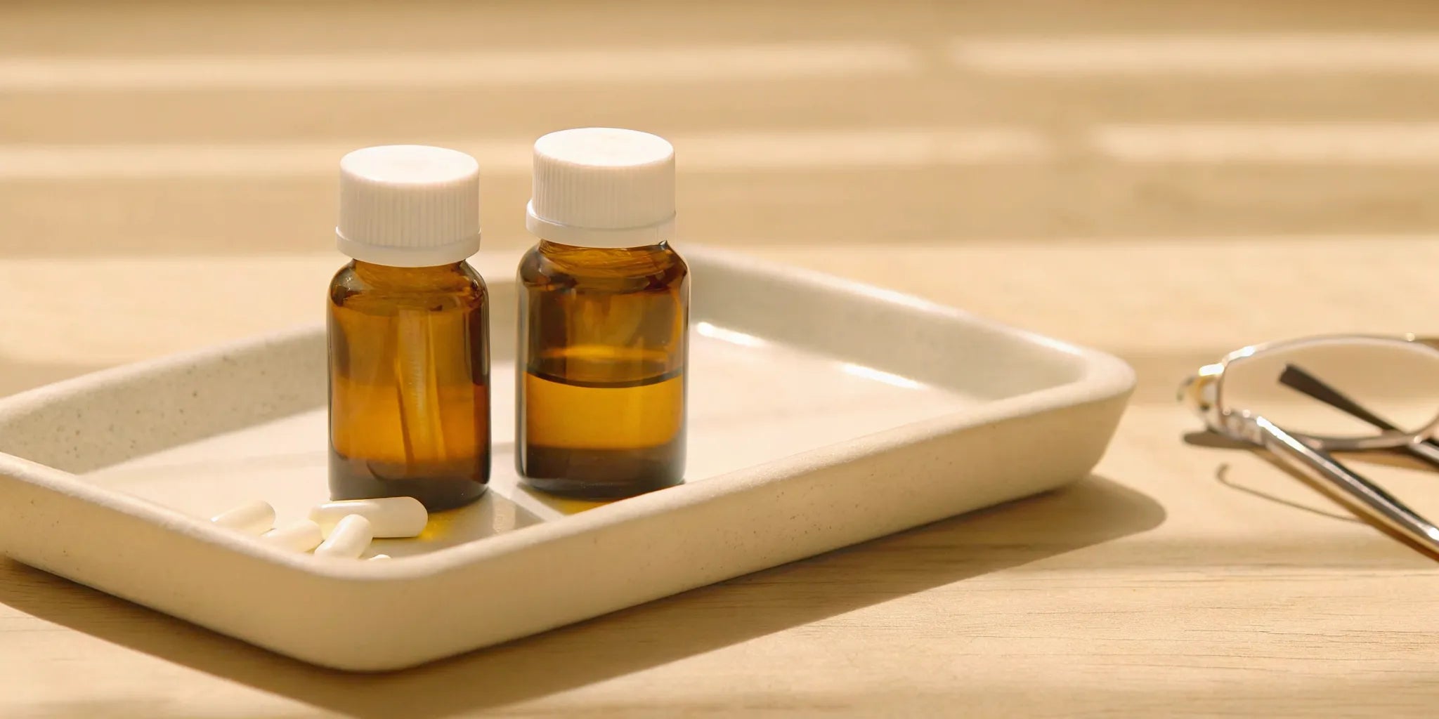 A buyer's selection of gut and mood supplements in amber bottles and capsules.