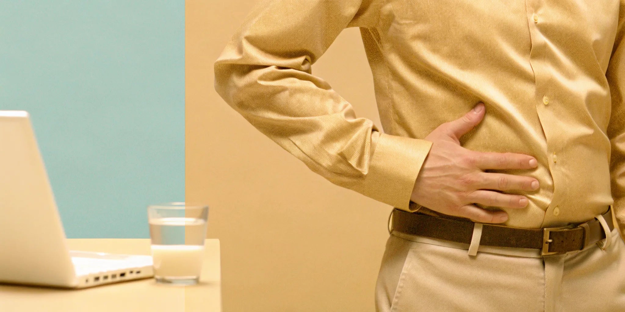 Man holding his stomach in discomfort because it keeps growling.