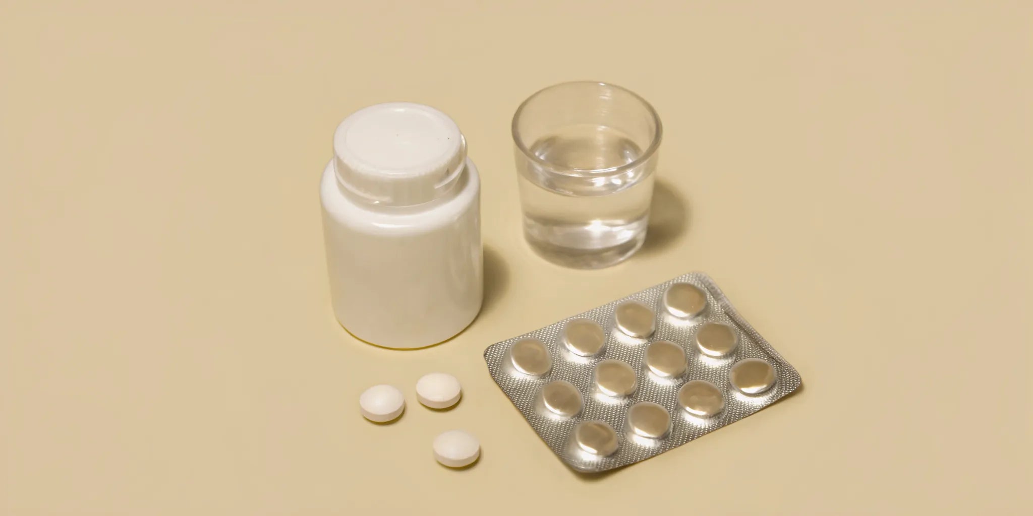 A bottle and blister packs of over the counter medicine for a bloated stomach.