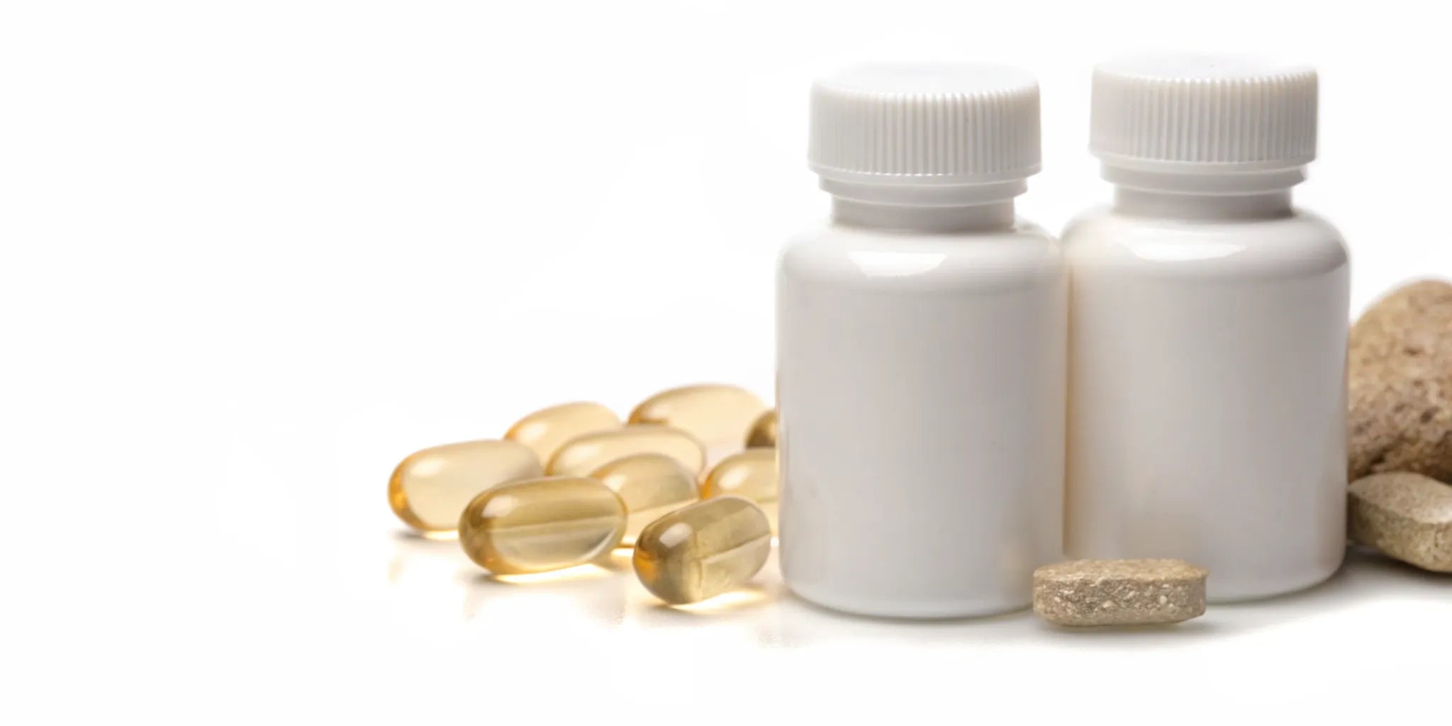 Supplement bottles with capsules and tablets for the gut and brain connection.