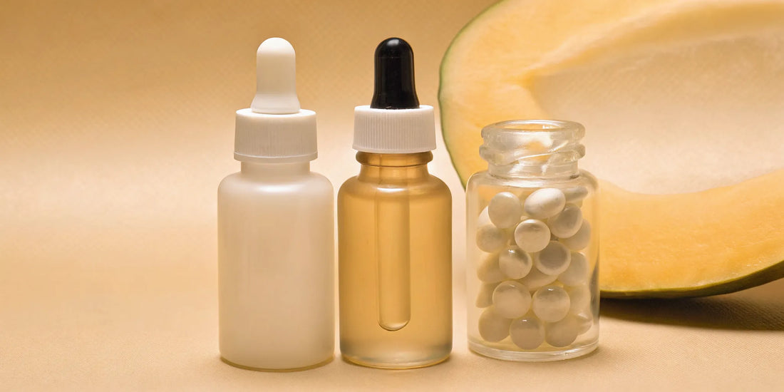 Capsules and liquid droppers of the best supplements for gut health and bloating.
