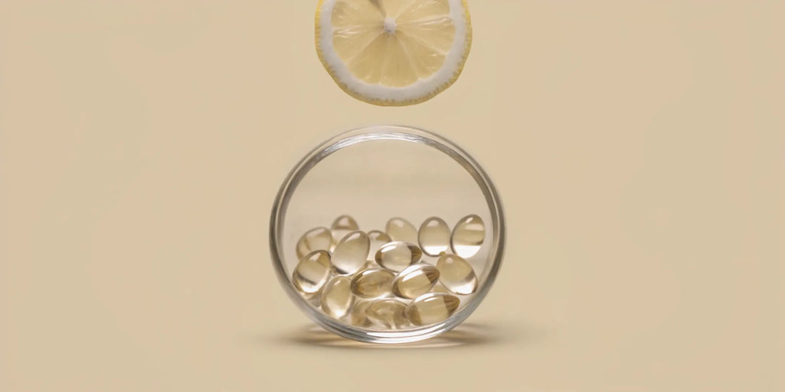 Glass jar of vitamins for digestion and metabolism with a lemon slice.