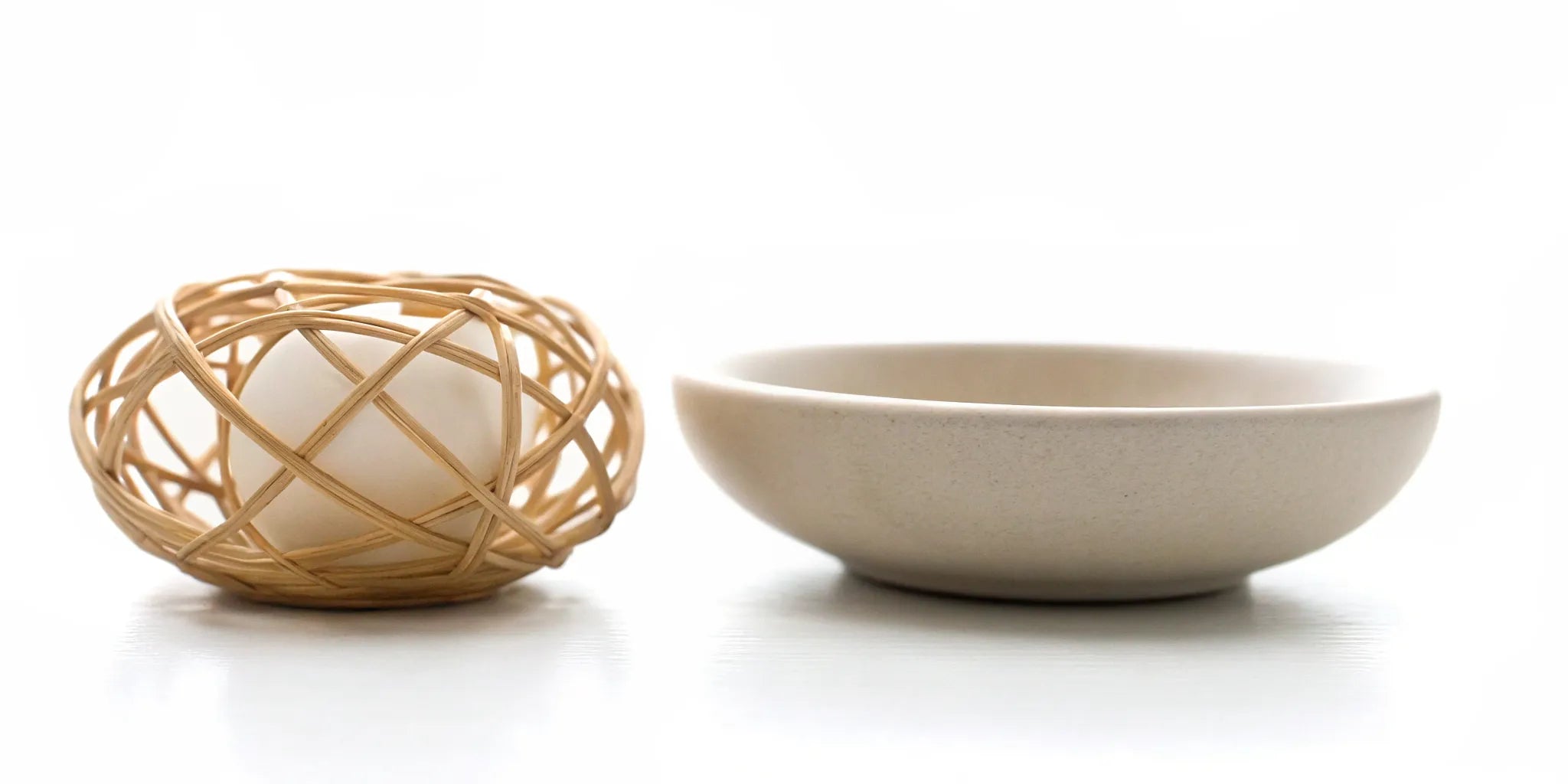 An egg balanced in a woven holder, a metaphor for finding mood balance for daily stress.