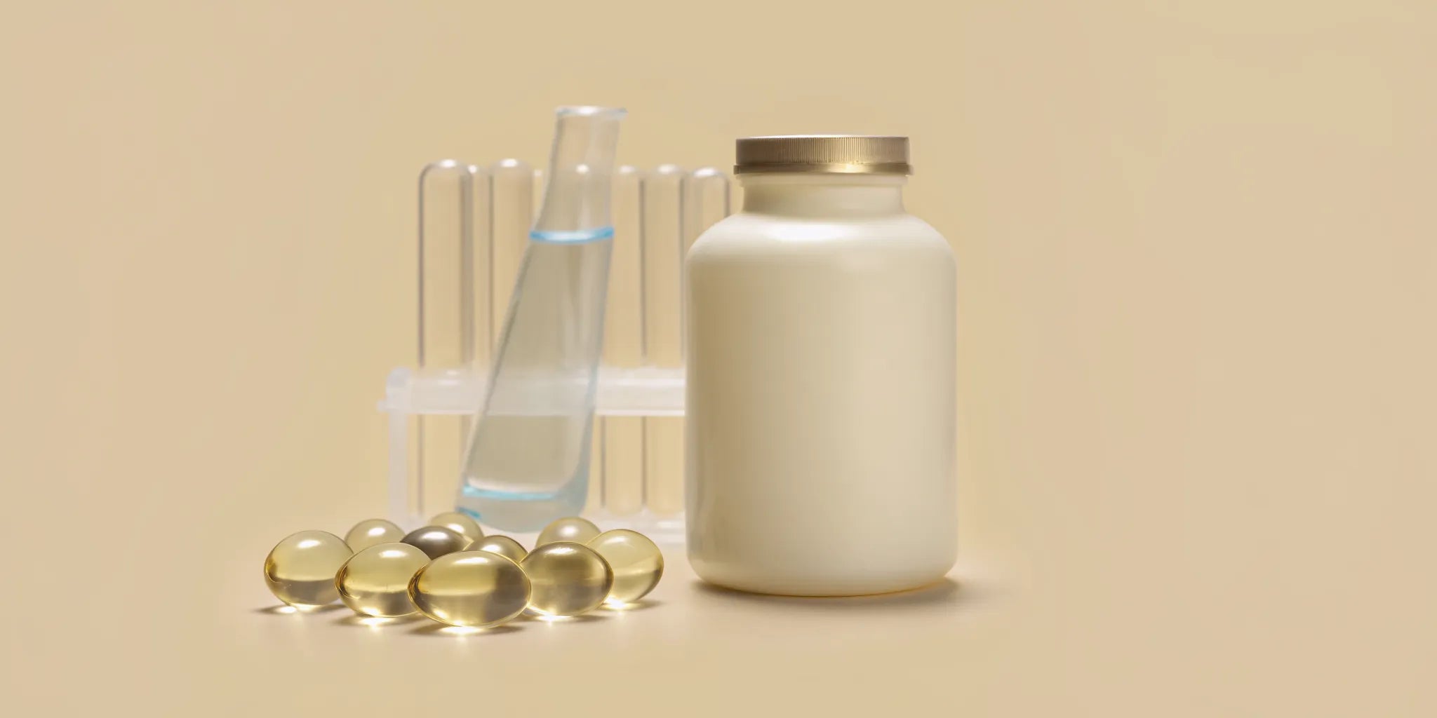 Supplements for mental clarity and energy with capsules, a bottle, and scientific test tubes.