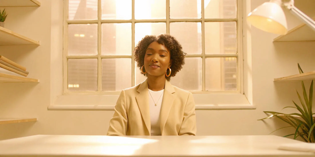 A calm woman at her desk, achieving mood balance for women.