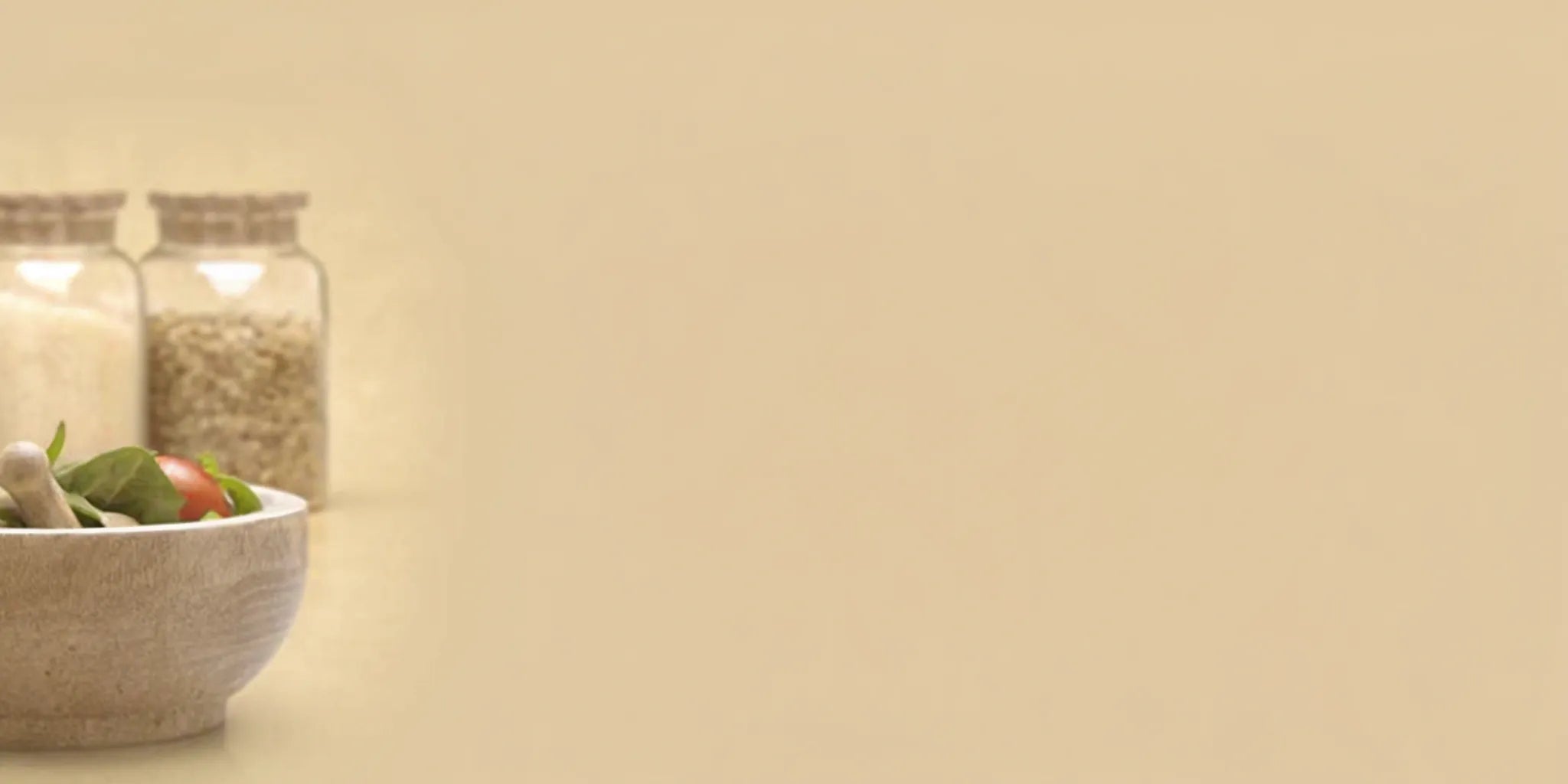 Bowl of fresh greens and grains, a healthy meal that creates postbiotics for gut-brain balance.