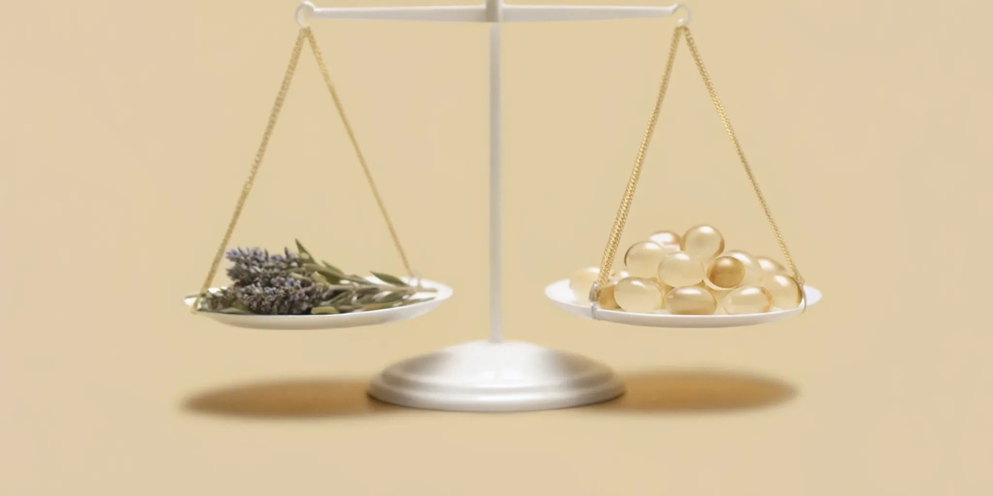 A balance scale weighs herbs against capsules for a mood balance formula.