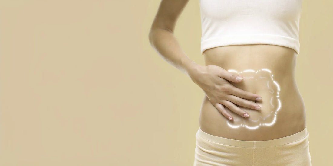 Woman holding her stomach, experiencing bloating and gas from probiotics.