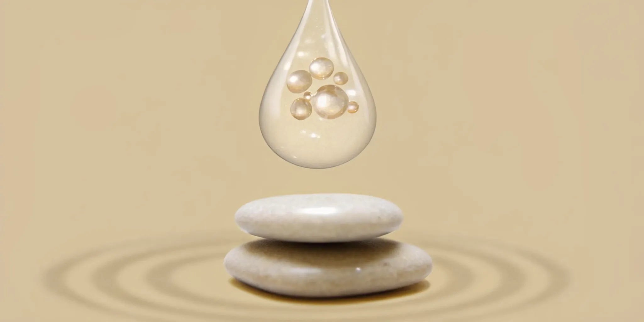 A clear drop of postbiotics over smooth stones for microbiome balance.