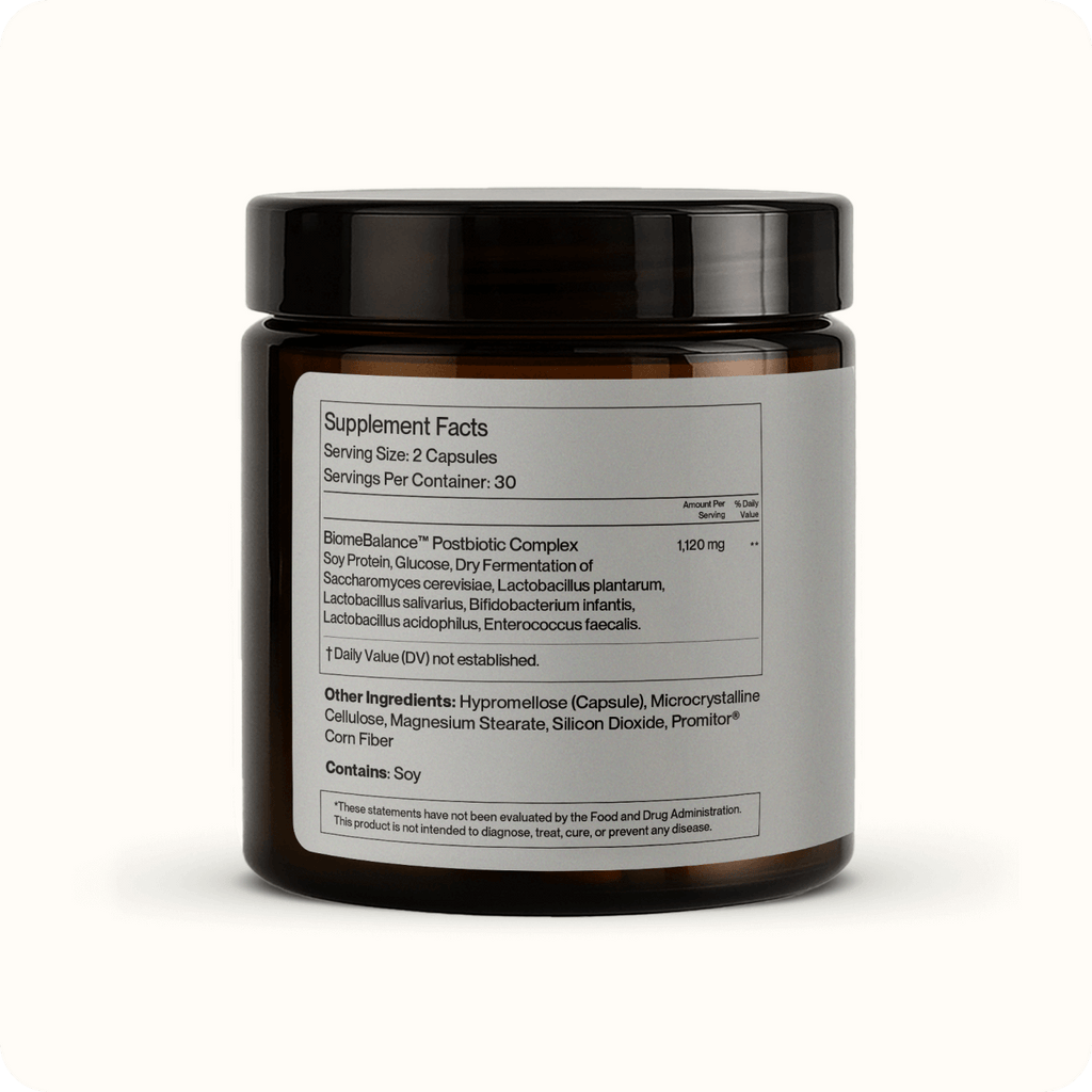 A brown Gut Balance postbiotic supplement jar with a white label listing supplement facts, digestion and bloating support ingredients, serving size, and postbiotic complex details. The jar has a dark screw-top lid.