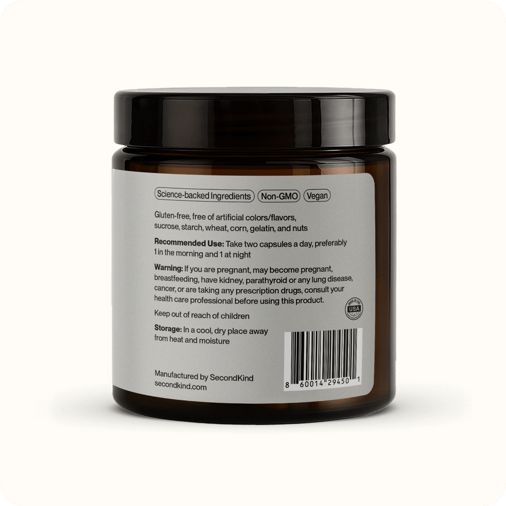A brown jar of Gut Balance Postbiotic supplement with a white label showing ingredient details, usage instructions, warnings, storage info, and manufacturing facts to support digestion. The barcode appears on the lower right corner of the label.